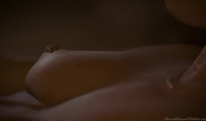 Attractive lesbian couple having intense sex in bed late night