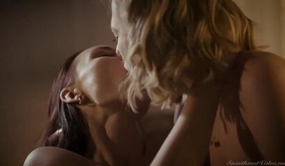 Attractive lesbian couple having intense sex in bed late night