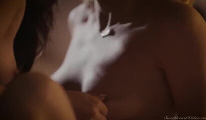 Attractive lesbian couple having intense sex in bed late night