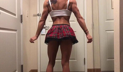 Muscular babe in sexy schoolgirl uniform showing off her fucking skills