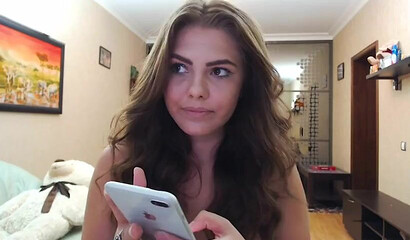 Natural brunette with giant tits masturbating on the sofa