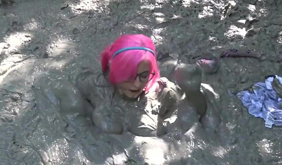 Smoking hot schoolgirl with big boobs swimming in mud