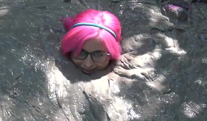 Smoking hot schoolgirl with big boobs swimming in mud