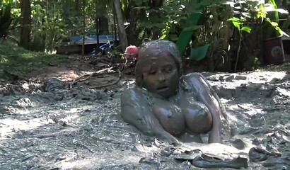 Smoking hot schoolgirl with big boobs swimming in mud