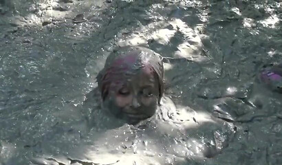 Smoking hot schoolgirl with big boobs swimming in mud