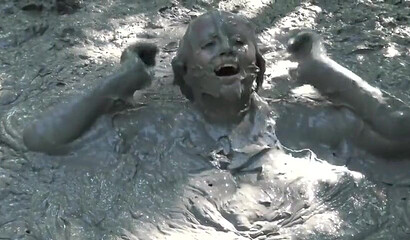 Smoking hot schoolgirl with big boobs swimming in mud