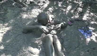 Smoking hot schoolgirl with big boobs swimming in mud