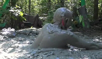 Smoking hot schoolgirl with big boobs swimming in mud