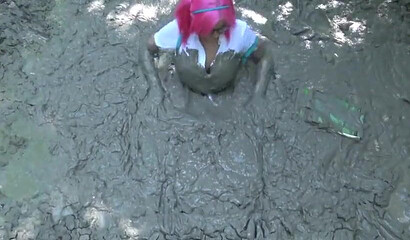 Smoking hot schoolgirl with big boobs swimming in mud