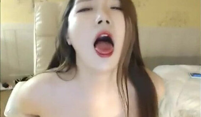 Cute Asian brunette masturbates on webcam in solo action