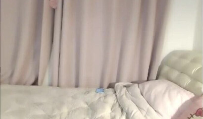 Cute Asian brunette masturbates on webcam in solo action