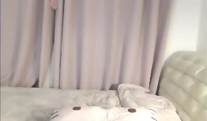 Cute Asian brunette masturbates on webcam in solo action