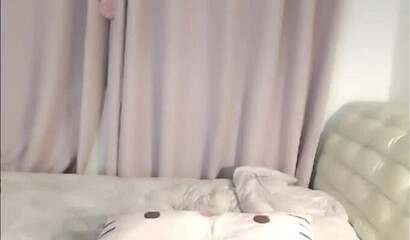 Cute Asian brunette masturbates on webcam in solo action