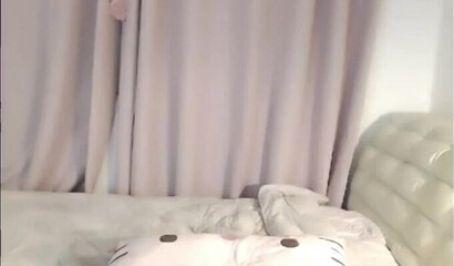 Cute Asian brunette masturbates on webcam in solo action