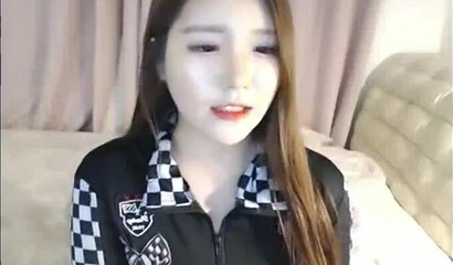 Cute Asian brunette masturbates on webcam in solo action