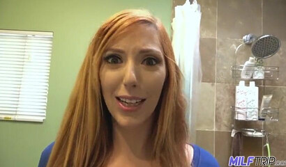 Busty redhead Lauren Phillips gives a blowjob and cock riding to her client