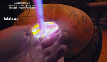 Chinese slut gets her asshole filled with glow sticks