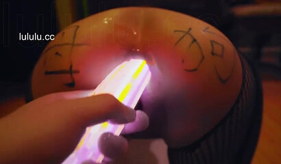 Chinese slut gets her asshole filled with glow sticks