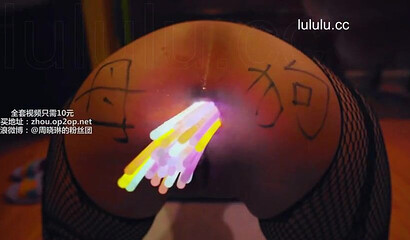 Chinese slut gets her asshole filled with glow sticks