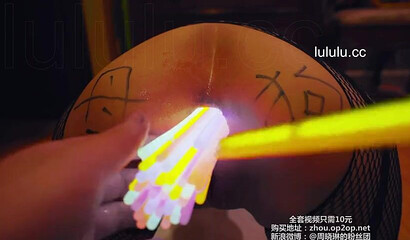 Chinese slut gets her asshole filled with glow sticks