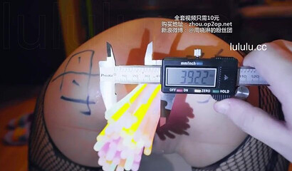 Chinese slut gets her asshole filled with glow sticks