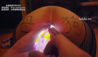 Chinese slut gets her asshole filled with glow sticks