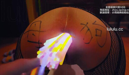 Chinese slut gets her asshole filled with glow sticks