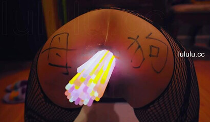 Chinese slut gets her asshole filled with glow sticks