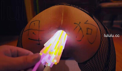 Chinese slut gets her asshole filled with glow sticks