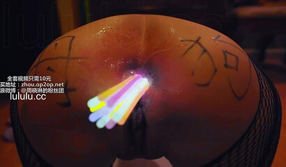 Chinese slut gets her asshole filled with glow sticks
