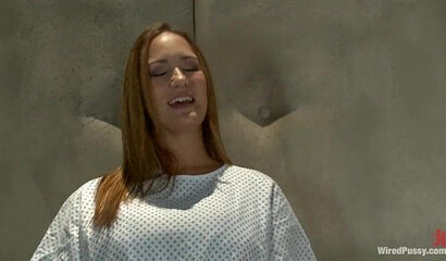 Big titted MILF tied up to a table gets pleasured by skinny dyke