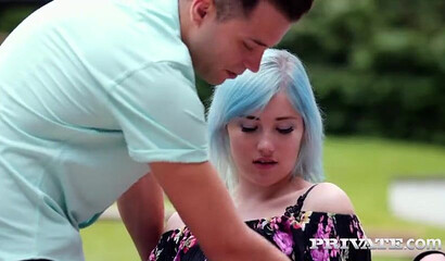 Blue haired teen Ashly Anderson sits on one stiff boner while getting other one anally