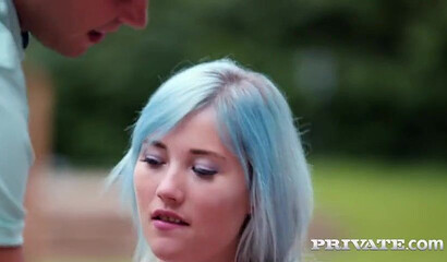 Blue haired teen Ashly Anderson sits on one stiff boner while getting other one anally
