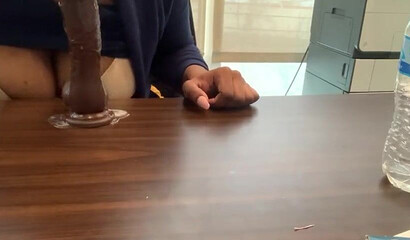 Ebony with big tits and monster butt rides sex toy attached to a table