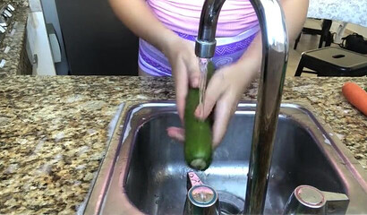 Amateur brunette shoves a cucumber up her aching asshole