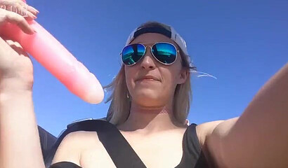 Horny blonde Ginger Banks rubs her bald pussy outdoors